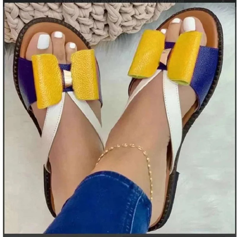 Butterfly button sandals with flat sole